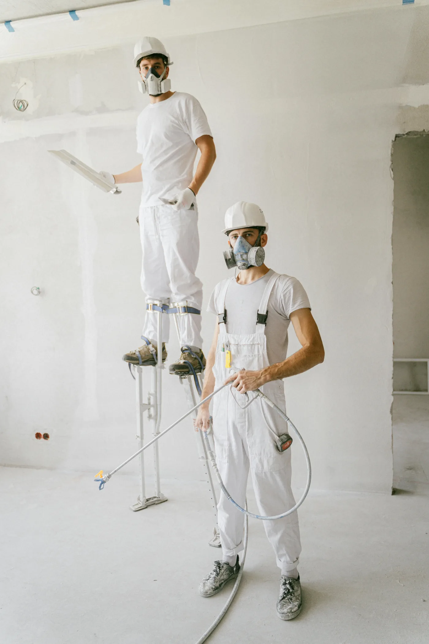 water damage restoration Minneapolis Minnesota — technician extracting water from flooded basement